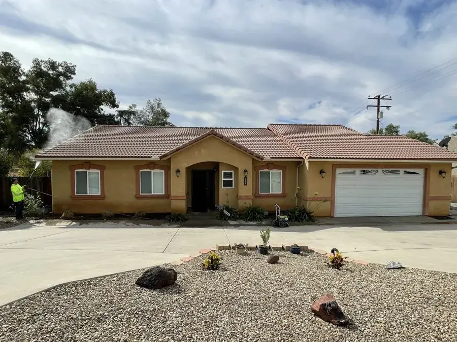 Stucco home before exterior repaint